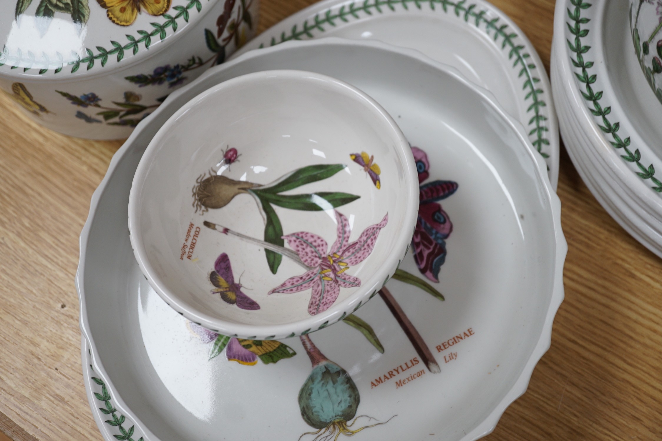 A mixed Portmerion dinner service- a biscuit jar and cover, tureens, serving dishes, teapot etc